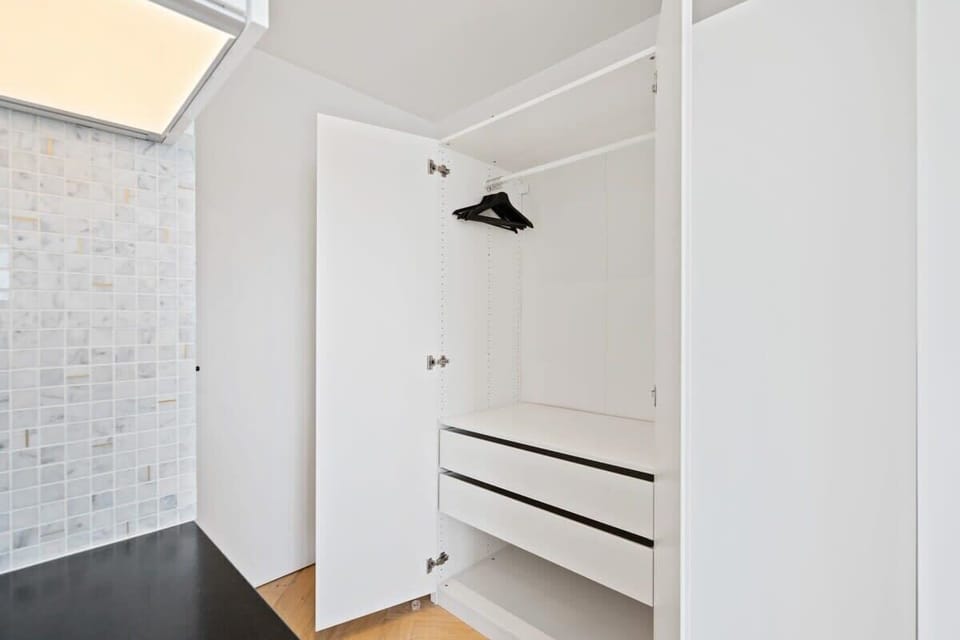 Keep your travel wardrobe chic and organized in our spacious closet.