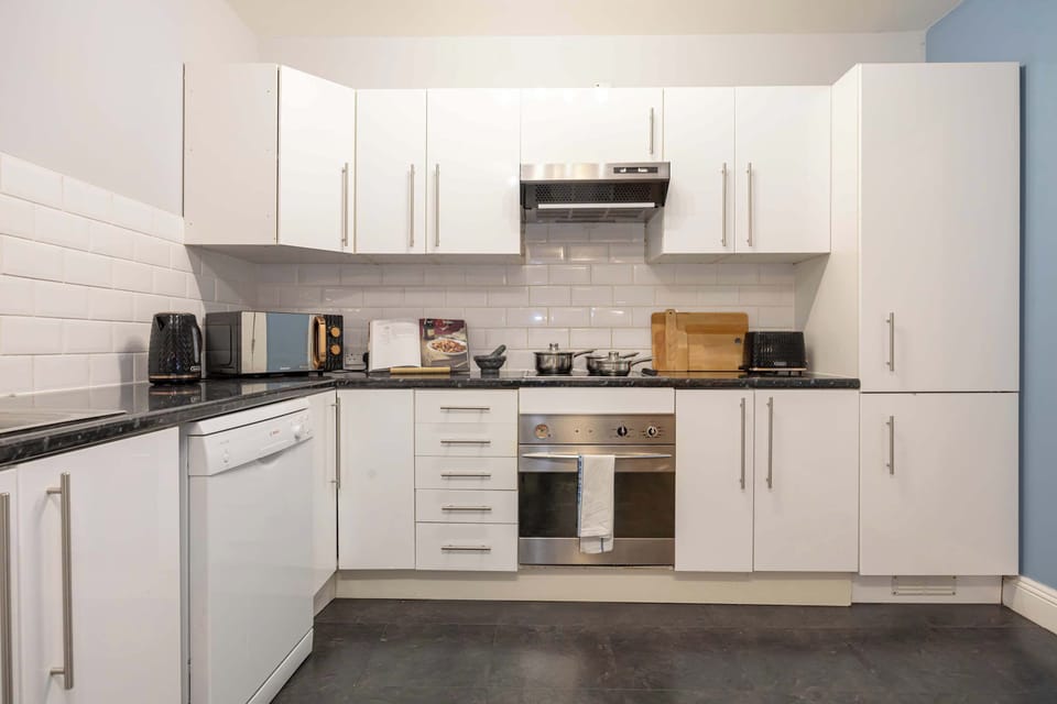 Whether you're cooking or sipping coffee, this kitchen is a cozy gathering spot.