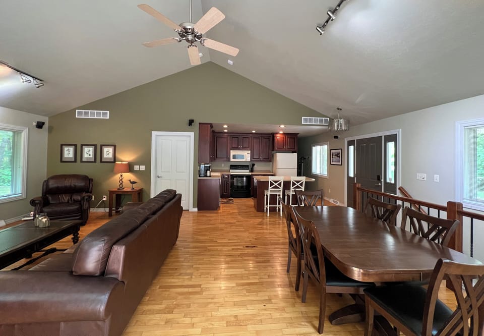Great room with living, dining and kitchen spaces.