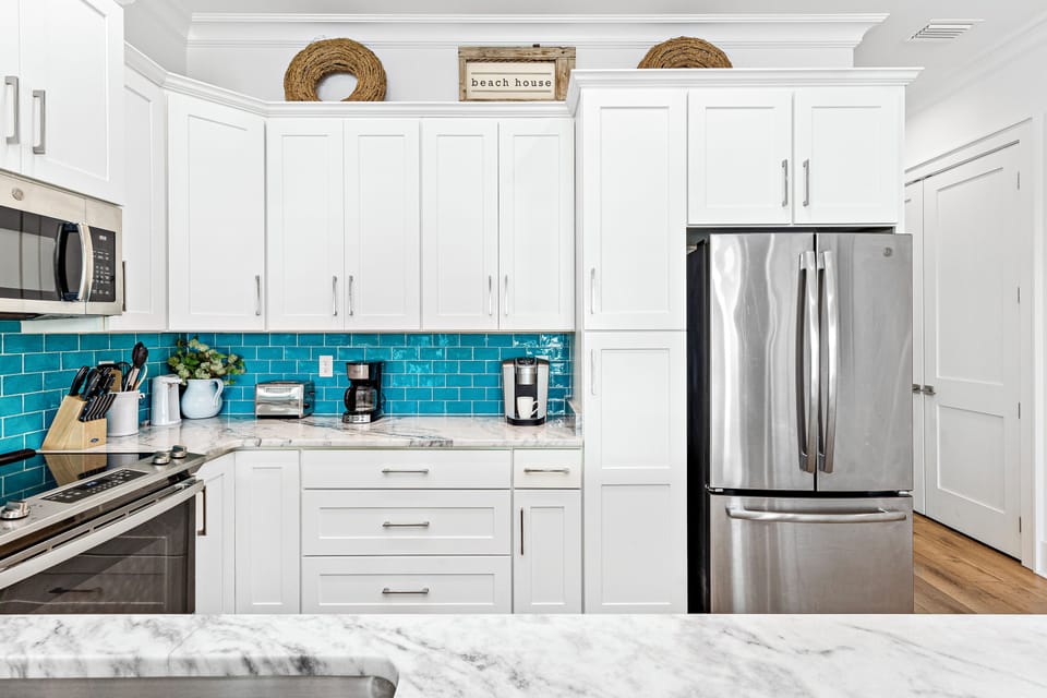 Stainless steel appliances and a pantry with plenty of room for snacks!