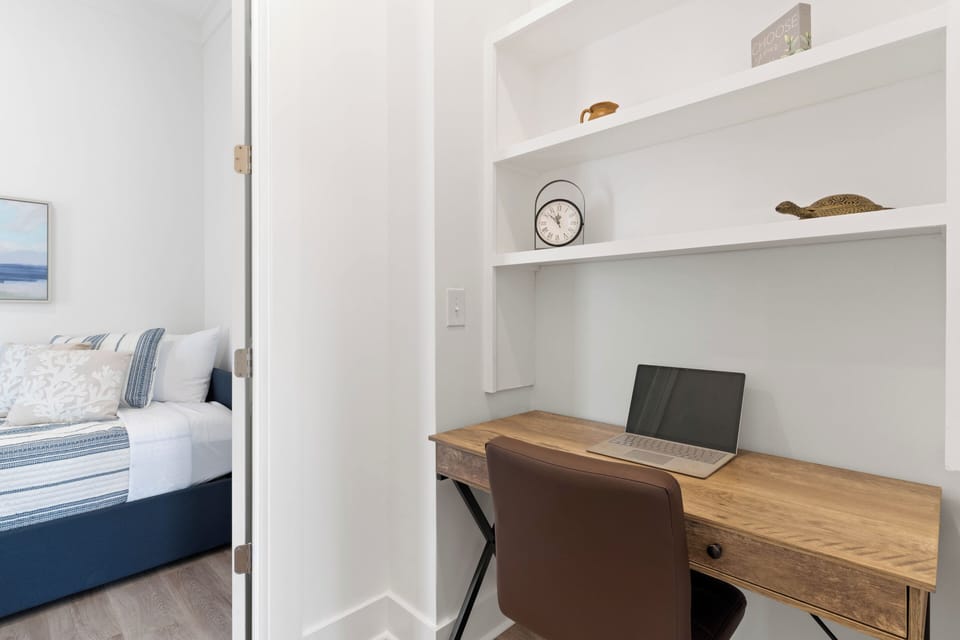 Office area with desk and twin day bed
