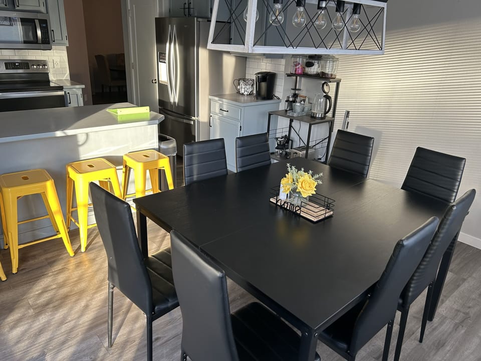 Dining area - table seats 8 plus 4 at kitchen bar & 4 more at game table