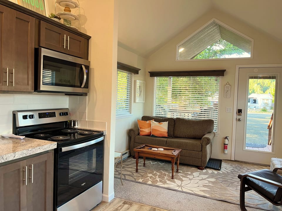 Kitchen with full size appliances, utensils, cookware. Relax in a comfy TV room!