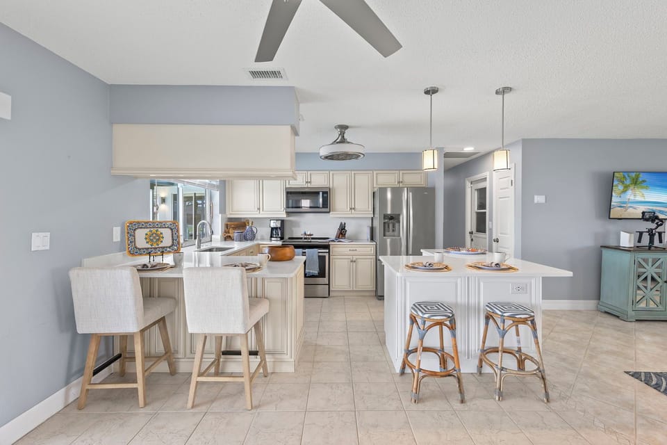 The kitchen has additional seating at the island