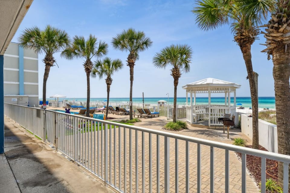 Step outside to palm-lined paths and sparkling beachfront access.