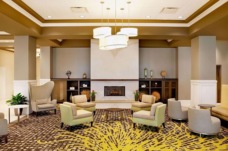 Unwind by the fireplace in a cozy conversation lounge.