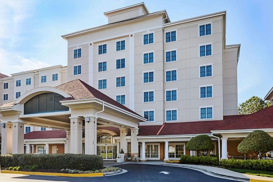 Arrive with ease under the covered portico entrance.