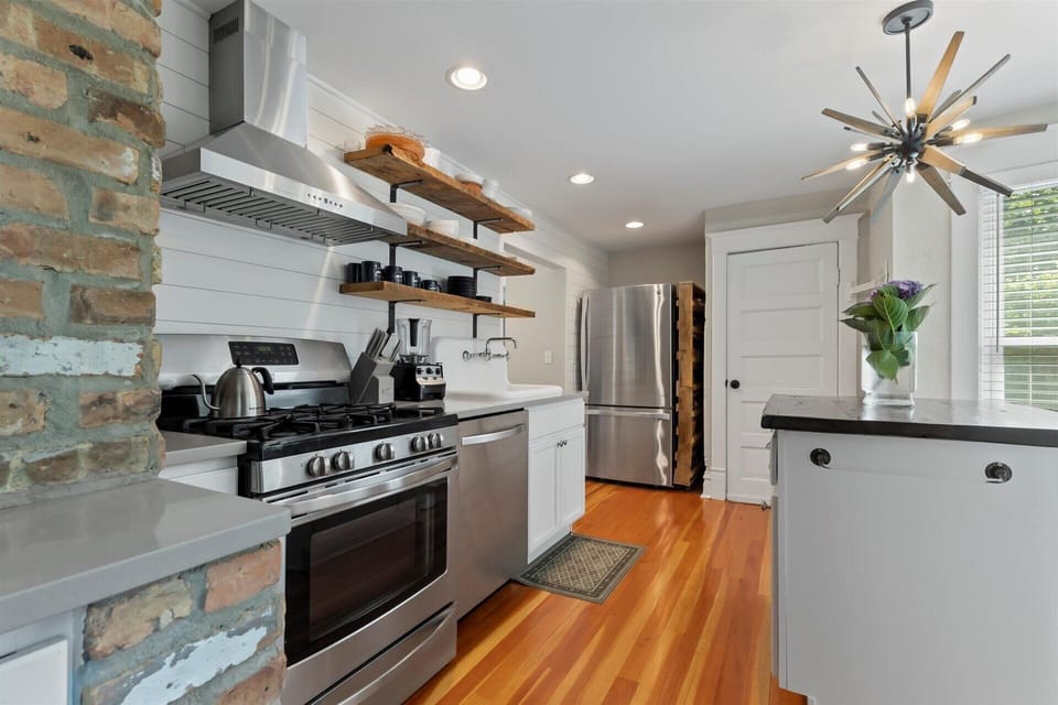Kitchen w/ gas stove, funky light fixture