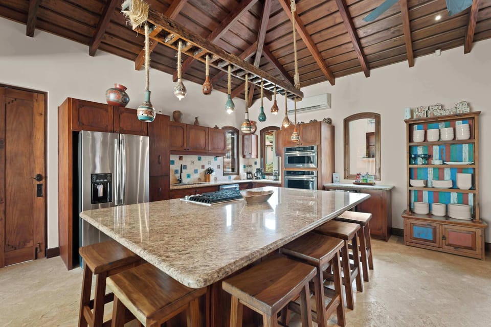 Whip up feasts and laughter in this vibrant gathering space.

