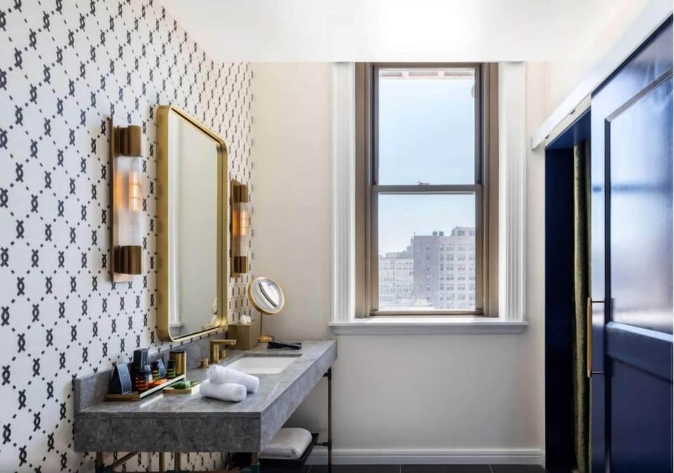 Rinse off in a luxe glass shower with premium brass hardware.