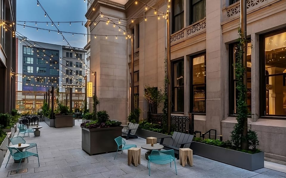 Linger outdoors on modern loungers surrounded by lush greenery.