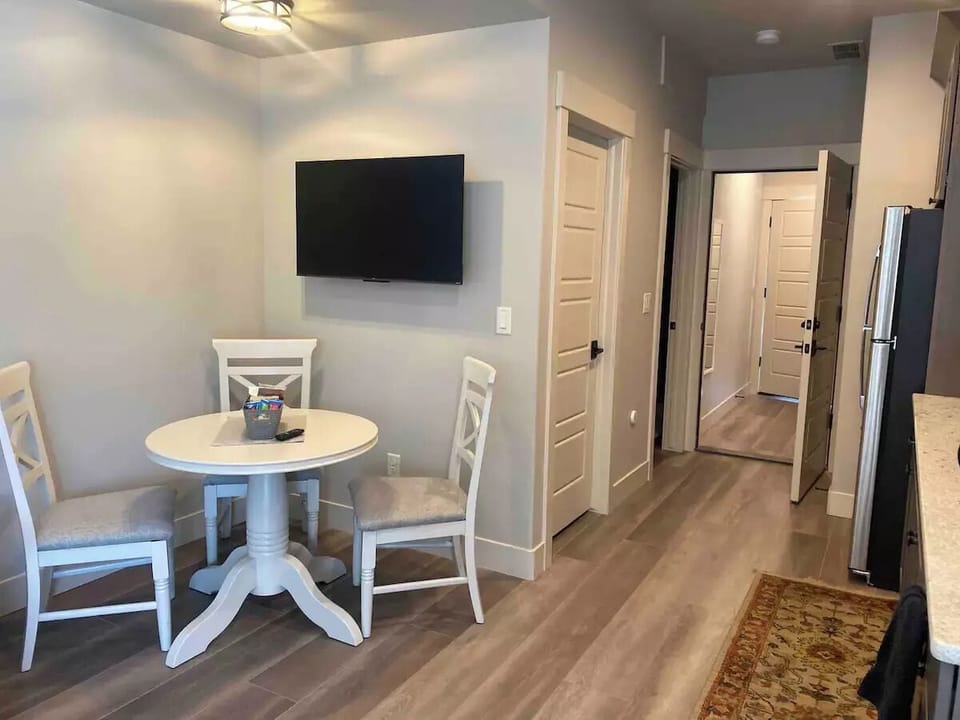 Dining table with three chairs and ROKU TV (with Netflix and Amazon Prime)