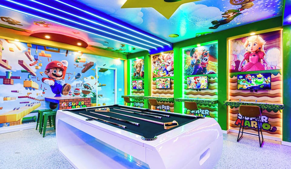 Epic Super Mario game room with arcade setups, pool table, and neon lights!
