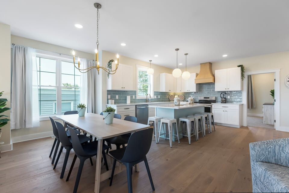 Gather around the spacious kitchen island and dining room table.