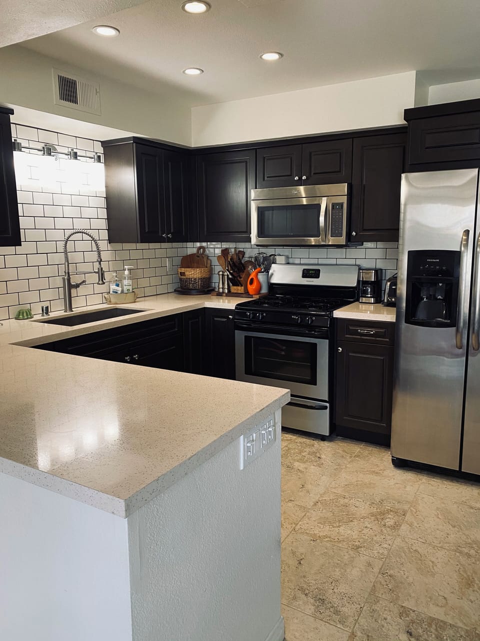 Fully stocked kitchen with full bar equipment  and wine cooler. 
