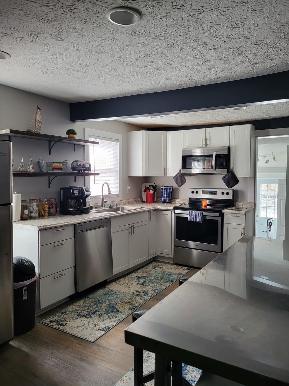 Full Kitchen with appliances, small appliances and TV