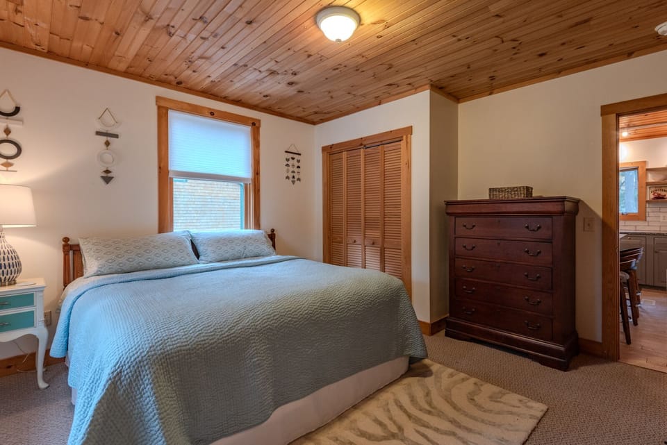 Wood slat ceiling provides optic appeal, insulation, and noise reduction. 