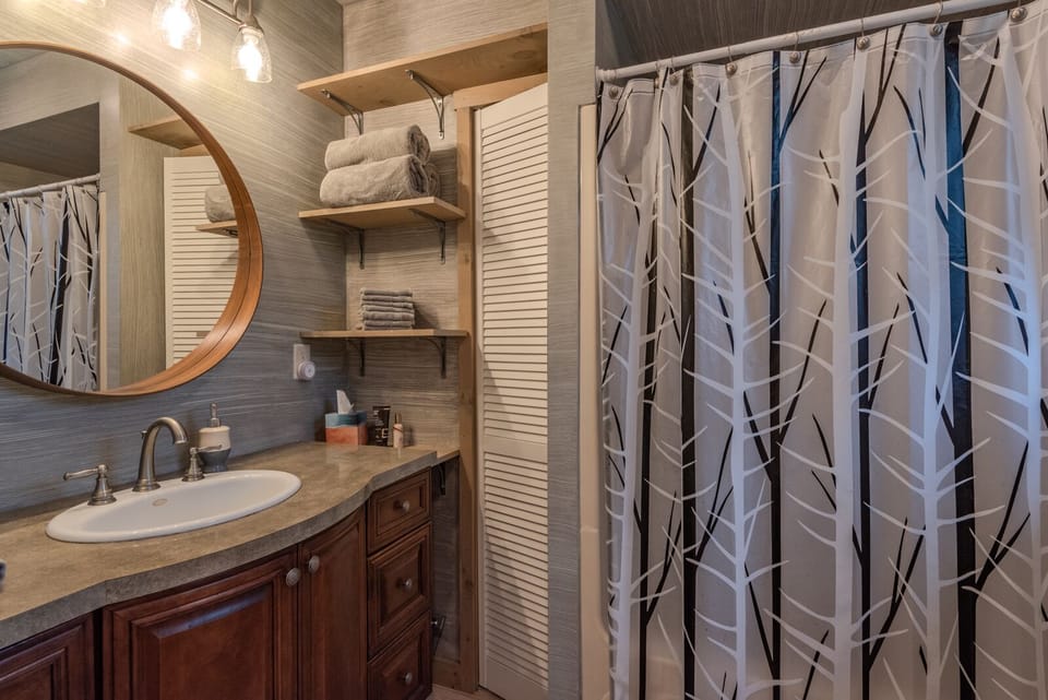 The upstairs master bath, directly off upstairs BR #1 (king) has tub & shower.