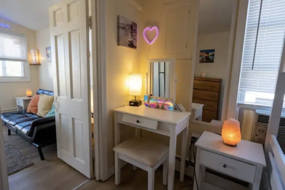 Bedroom w/full-sized pullout double futon, full length mirror & AC in bedroom.