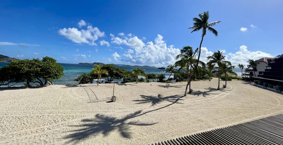 An extended beach view toward the pool from Tropical Tide’s balcony.