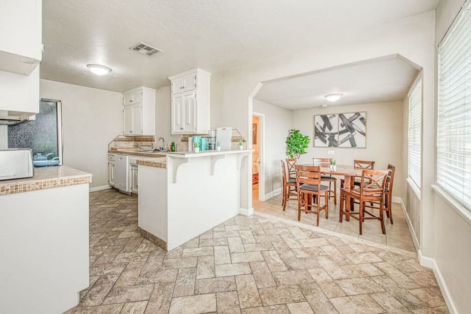 Gather for culinary creations and engaging conversations in this bright space.