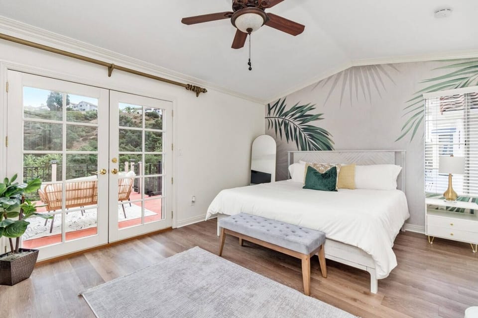 King-sized bed with outdoor deck access