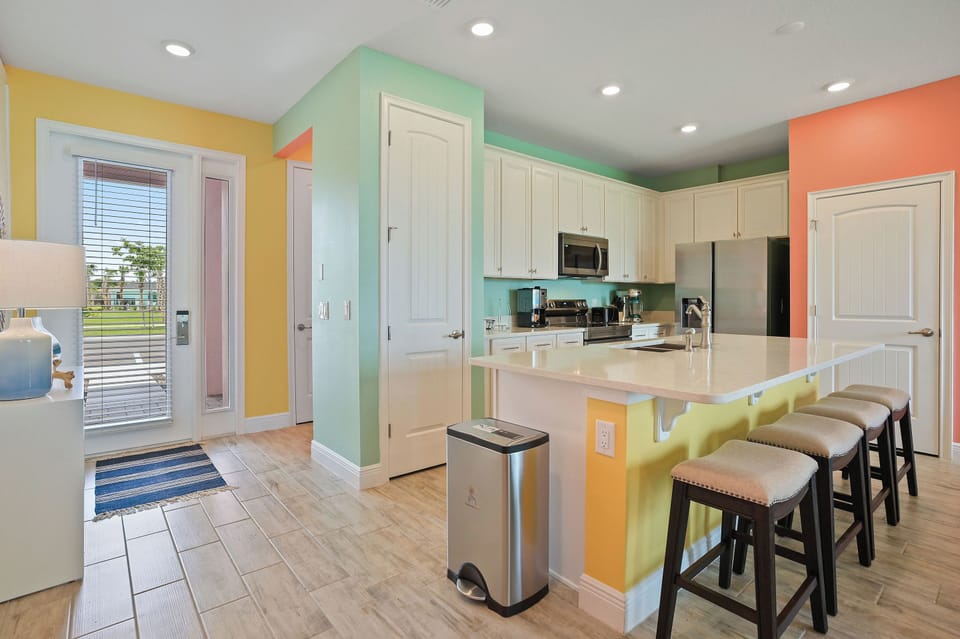 Despite its minimalist design, this kitchen is fully equipped with modern appliances
