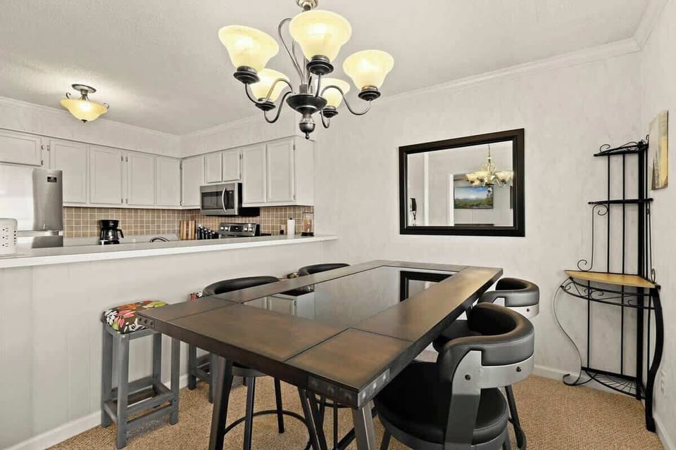 Whether it's a cozy family meal or casual bar seating, our dining area effortlessly flows into the attractive living room, creating the perfect space for shared moment.