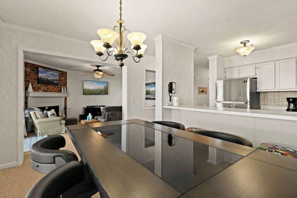 Versatile dining options await you – from the family table to the stylish bar seating. Connect, dine, and relax as the dining area gracefully opens into the inviting living room. 