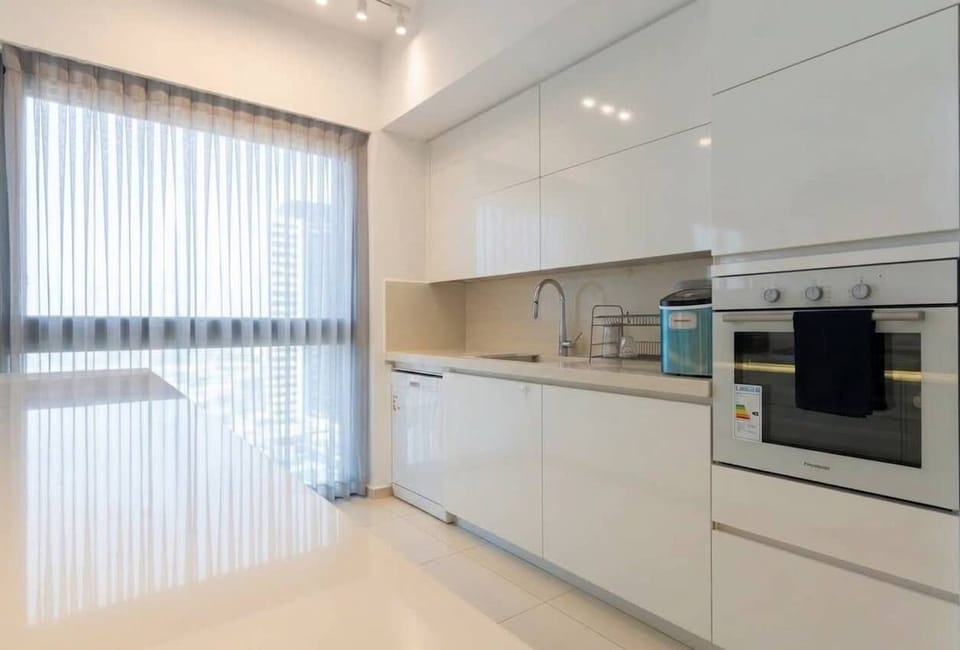 Fully equipped kitchen includes premium appliances, ideal for preparing meals before heading to nearby restaurants.