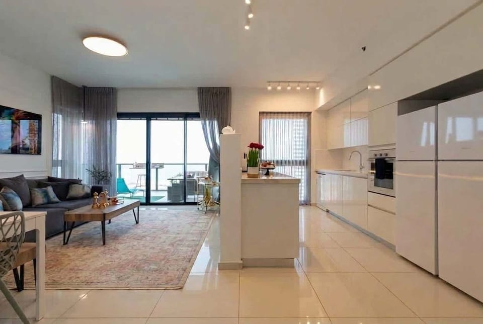 Wide open layout showcases spacious design, ideal for families enjoying comfort near beach and attractions.