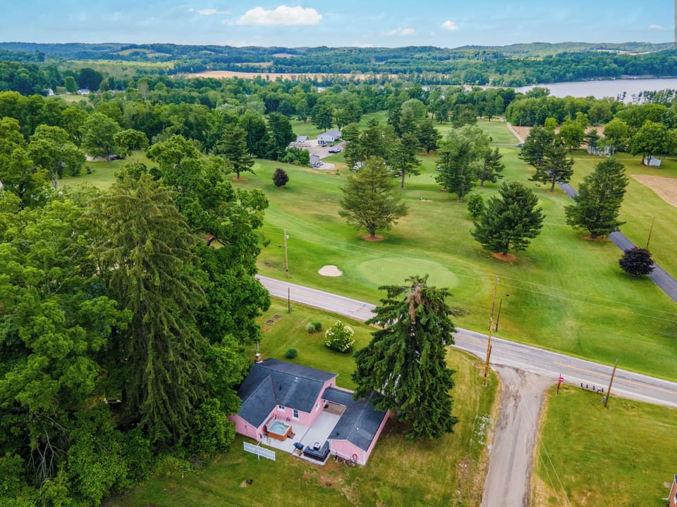 House on hill overlooking par 3 golf course