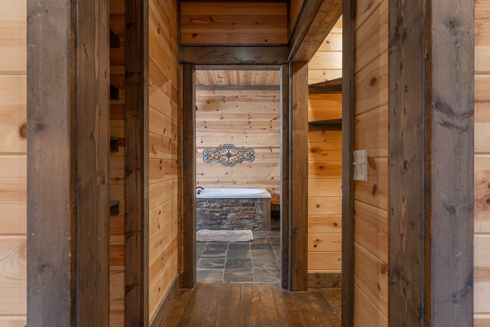 Attached ensuite is connected by a short hallway with a shelved closet on the left and a walk in closet on the right. Unpack and stay awhile!