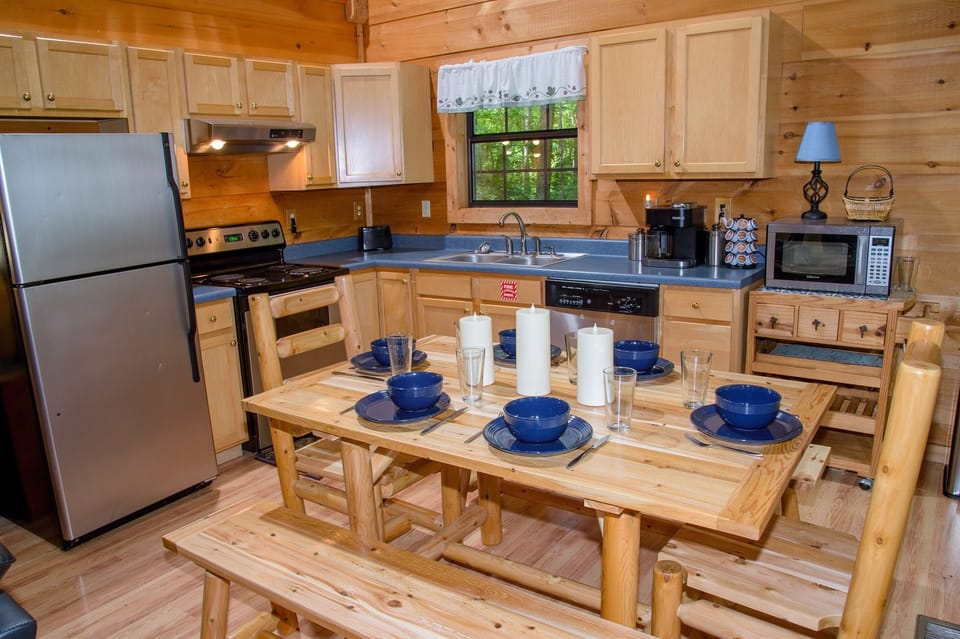 Fully equipped kitchen and log dining area that can accommodate eight people.