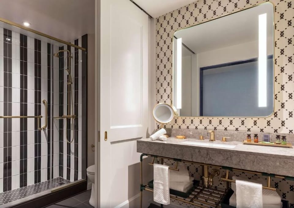 Start your day at the glowing mirror with ample counter space.