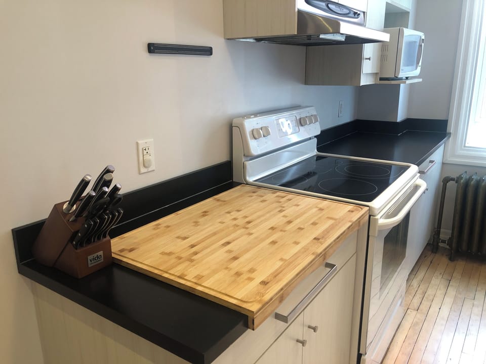 Chef knives and large bamboo cutting board movable to any counter