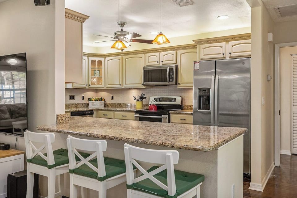 Kitchen with 3 seat bar stools