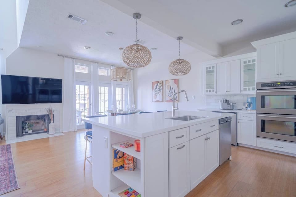 Open, bright, and family-friendly—this main living space flows seamlessly from kitchen to dining to lounging, with thoughtful touches for all ages.