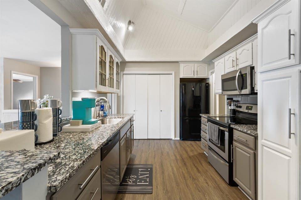 Full kitchen with pots & pans, dishes, glasses, silverware, utensils, & Keurig.
