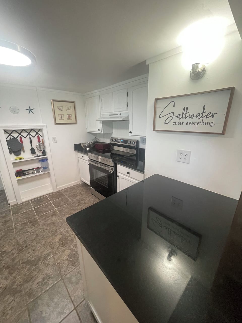 Kitchen with a new stove and Microwave 
