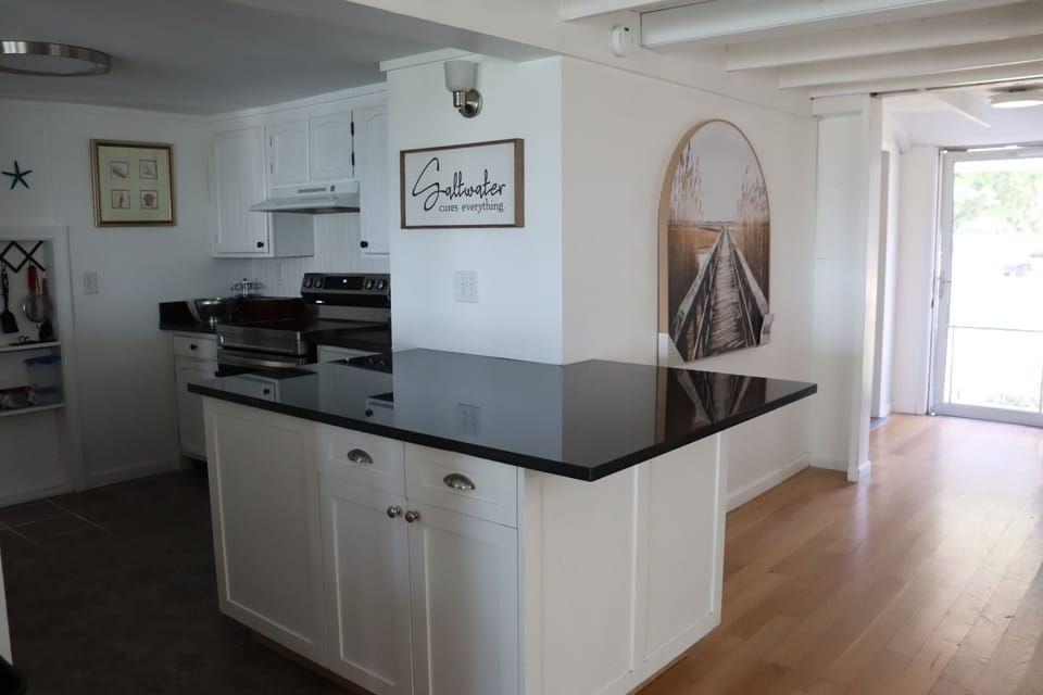Kitchen fully stocked with island 