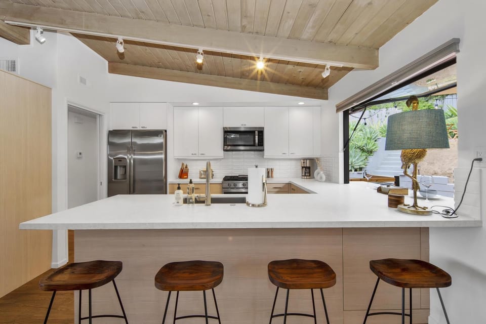 Kitchen with bar stool seating.
