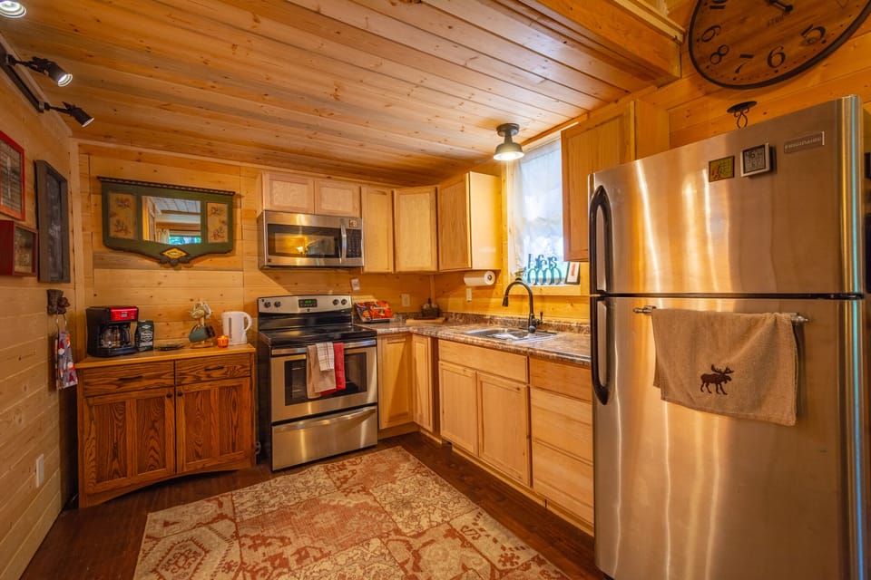 Full Size Stainless Steel Appliances, electric range, microwave, refrigerator