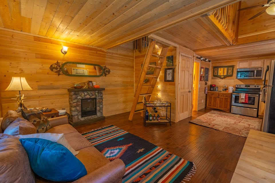 Living open to Kitchen & Bath, loft area above with Ladder Access
