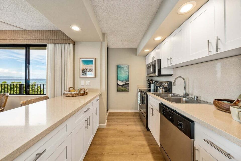 A sleek, modern kitchen with stainless‑steel appliances and a picture‑perfect view right from the counter.