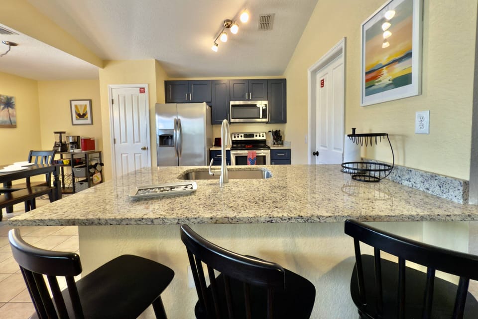 Updated Kitchen with granite counters and stainless steel appliances