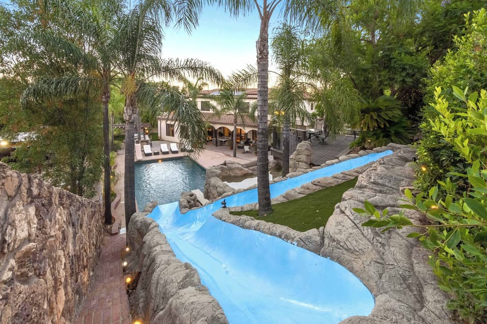 Theme park–style water slide—truly one of a kind and unlike anything you'll find in a short-term rental.