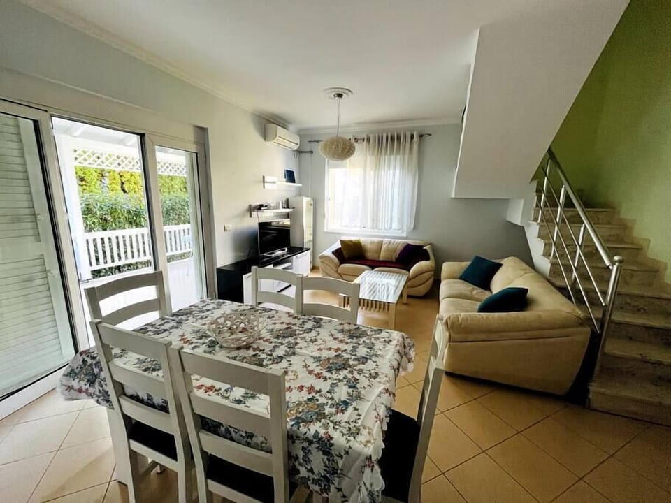 Living room with couches or extra bed placed.