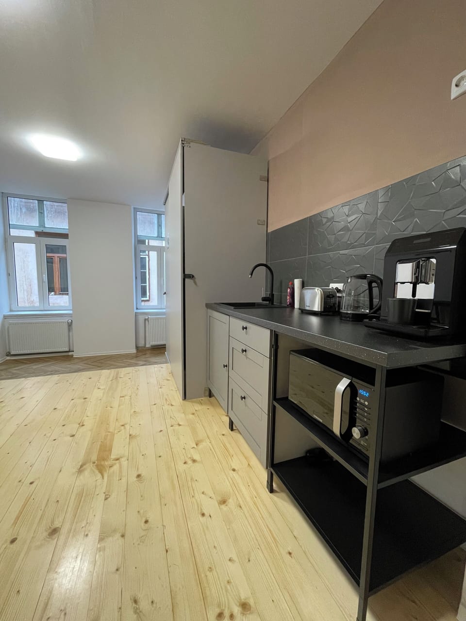 Common area kitchen with coffee machine, microwave oven and toaster