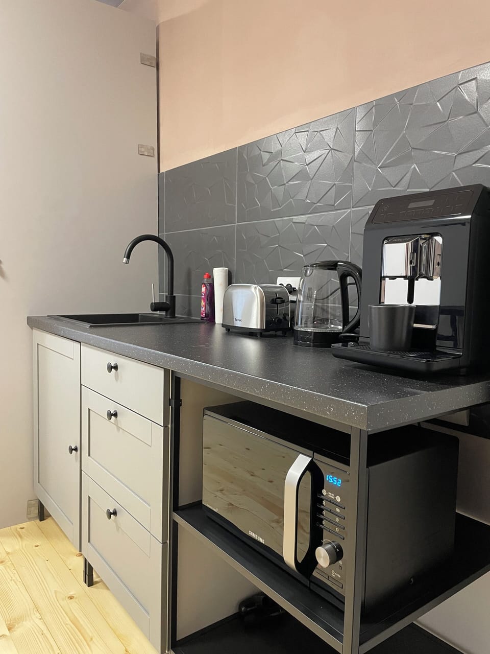 Common area kitchen with a coffee machine, microwave and toaster
